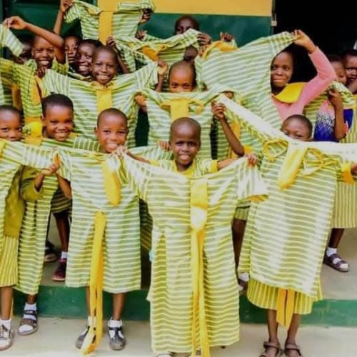 Pupils showing off their new school uniforms