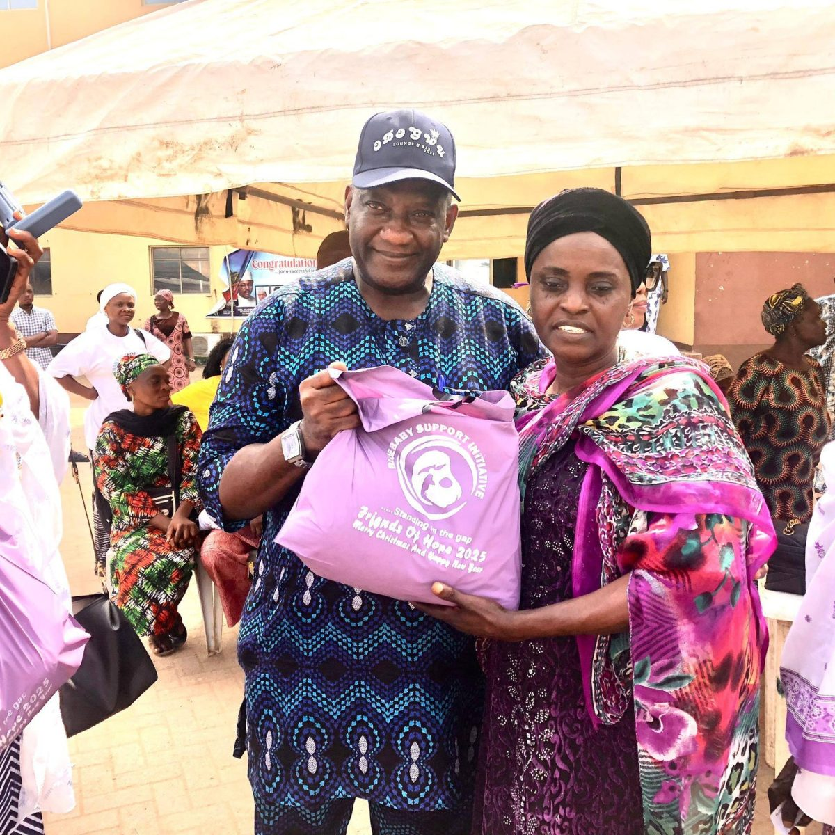 Beneficiary receiving a Friends of Hope relief package