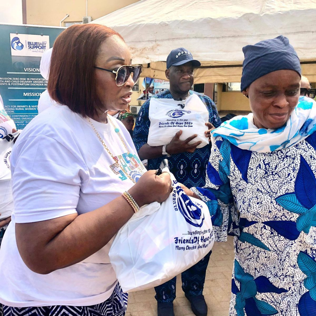 BBSI team member handing out relief packages