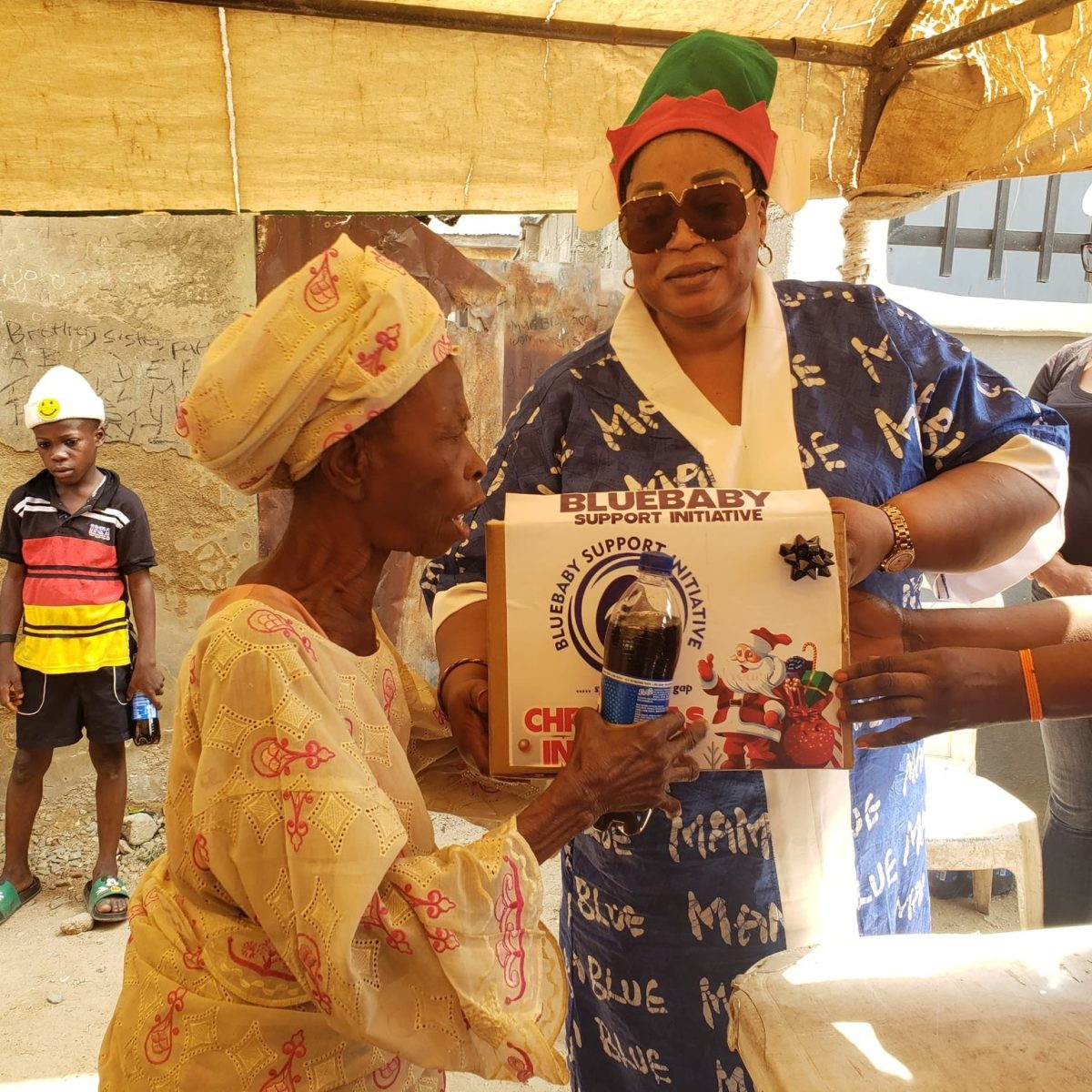 Beneficiary receiving a Christmas In A Box gift